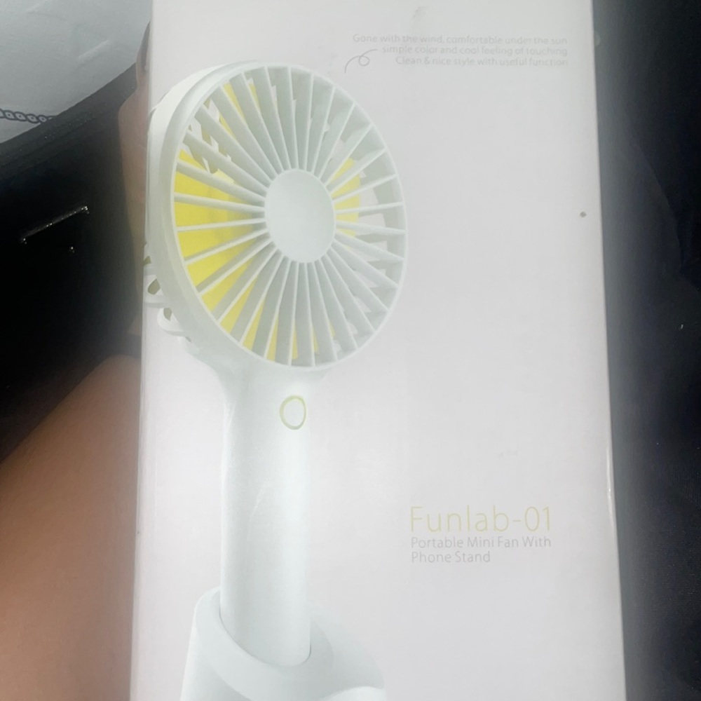 Mini fan with portable phone stand